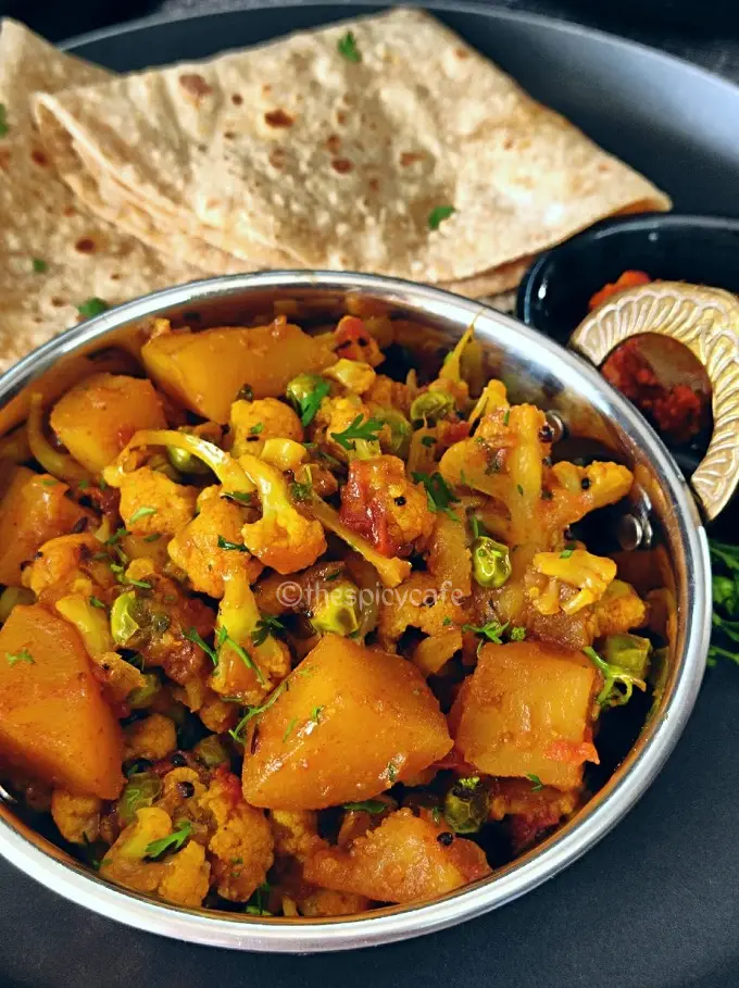 Aloo Gobi Matar Sabji | Cauliflower, Potatoes & Peas Curry Aloo Gobi Matar Sabji | Cauliflower, Potatoes & Peas Curry https://thespicycafe.com/wp-content/uploads/2024/01/1-aloo-gobi-matar-sabji-cauliflower-potatoes-and-peas-curry-easy-quick-simple-lunch-dinner-sunday-meals-vegan-vegetarian-healthy-tiffin-box-lunch-box-Indian-restaurant-style-recipe.png https://thespicycafe.com/aloo-gobi-matar-sabji-recipe/