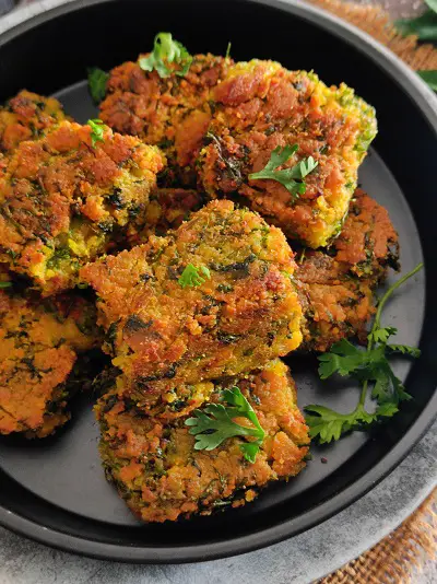 Easy Maharashtrian Kothimbir Vadi Without Steaming Easy Maharashtrian Kothimbir Vadi Without Steaming https://thespicycafe.com/wp-content/uploads/2023/01/kothimbir-vadi-maharashtrian-traditional-vegan-vegetarian-Indian-recipe.jpg https://thespicycafe.com/easy-maharashtrian-kothimbir-vadi-without-steaming/