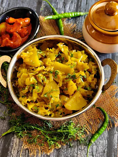 Kobi Batata Bhaji (Cabbage Potato Sabzi) Kobi Batata Bhaji (Cabbage Potato Sabzi) https://thespicycafe.com/wp-content/uploads/2023/03/16-patta-gobi-ki-sabji-cabbage-potato-curry-kobi-chi-bhaji-vegan-vegetarian-easy-lunch-dinner-breakfast-sabzi-indian-recipes-maharashtrian.jpg https://thespicycafe.com/cabbage-potato-recipe/