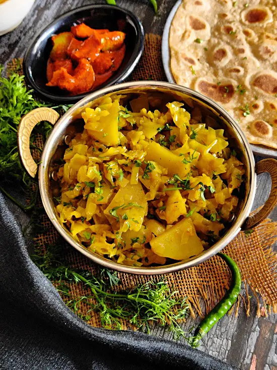 Kobi Batata Bhaji (Cabbage Potato Sabzi) Kobi Batata Bhaji (Cabbage Potato Sabzi) https://thespicycafe.com/wp-content/uploads/2023/03/16-patta-gobi-ki-sabji-cabbage-potato-curry-kobi-chi-bhaji-vegan-vegetarian-easy-lunch-dinner-breakfast-sabzi-indian-recipes-maharashtrian.jpg https://thespicycafe.com/cabbage-potato-recipe/