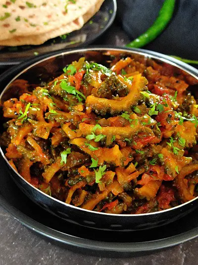 Karlyachi Bhaji | Karela Sabzi |Bitter Gourd Stir Fry Karlyachi Bhaji | Karela Sabzi |Bitter Gourd Stir Fry https://thespicycafe.com/wp-content/uploads/2023/08/1-karla-sabji-karlyachi-bhaji-maharashtrian-karela-sabji-easy-quick-vegan-vegetarian-bitter-gourd-stir-fry-lunch-dinner.png https://thespicycafe.com/karela-sabzi-recipe/