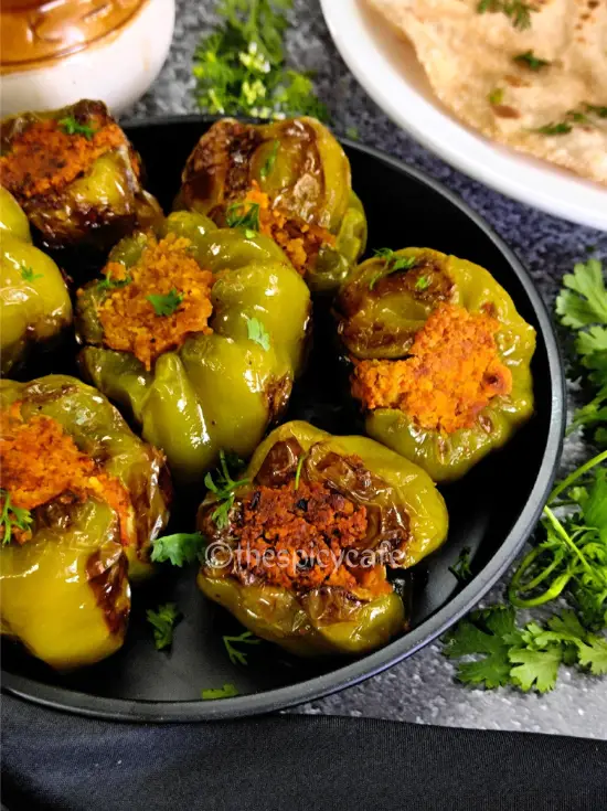 Bharli Dhobli Mirchi | Bharwa Shimla Mirch With Besan | Stuffed Capsicum Without Potatoes https://thespicycafe.com/wp-content/uploads/2023/08/1-bharwa-shimla-mirch-besan-shimla-stuffed-capsicum-vegan-vegetarian-protein-rich-side-dish-Indian-snack-easy-quick-simple-lunch-dinner.png https://thespicycafe.com/category/maharashtrian-recipes/