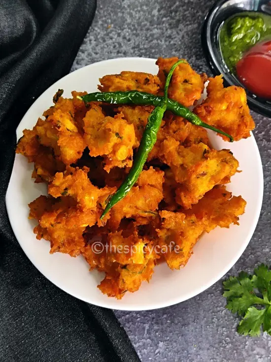Corn Pakoda Recipe | Makai Bhajiya | Sweet Corn Fritters Corn Pakoda Recipe | Makai Bhajiya | Sweet Corn Fritters https://thespicycafe.com/wp-content/uploads/2023/08/2-sweet-corn-pakoda-crispy-corn-fritters-makai-bhajiya-vegan-vegetarian-Indian-street-food-snack-breakfast-lunch-dinner-easy-quick-simple-1.png https://thespicycafe.com/corn-pakoda-recipe/