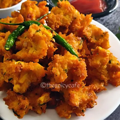 Corn Pakoda Recipe | Makai Bhajiya | Sweet Corn Fritters Corn Pakoda Recipe | Makai Bhajiya | Sweet Corn Fritters https://thespicycafe.com/wp-content/uploads/2023/08/2-sweet-corn-pakoda-crispy-corn-fritters-makai-bhajiya-vegan-vegetarian-Indian-street-food-snack-breakfast-lunch-dinner-easy-quick-simple-1.png https://thespicycafe.com/corn-pakoda-recipe/