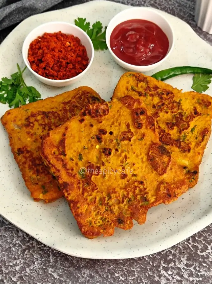 Besan Bread Toast | Besan Toast Besan Bread Toast | Besan Toast https://thespicycafe.com/wp-content/uploads/2024/01/1-besan-bread-toast-an-Indian-snack-recipe-made-with-gramflour.-vegan-vegetarian-delicious-easy-quick-simple-snack-for-tea-time.png https://thespicycafe.com/besan-bread-toast-recipe/